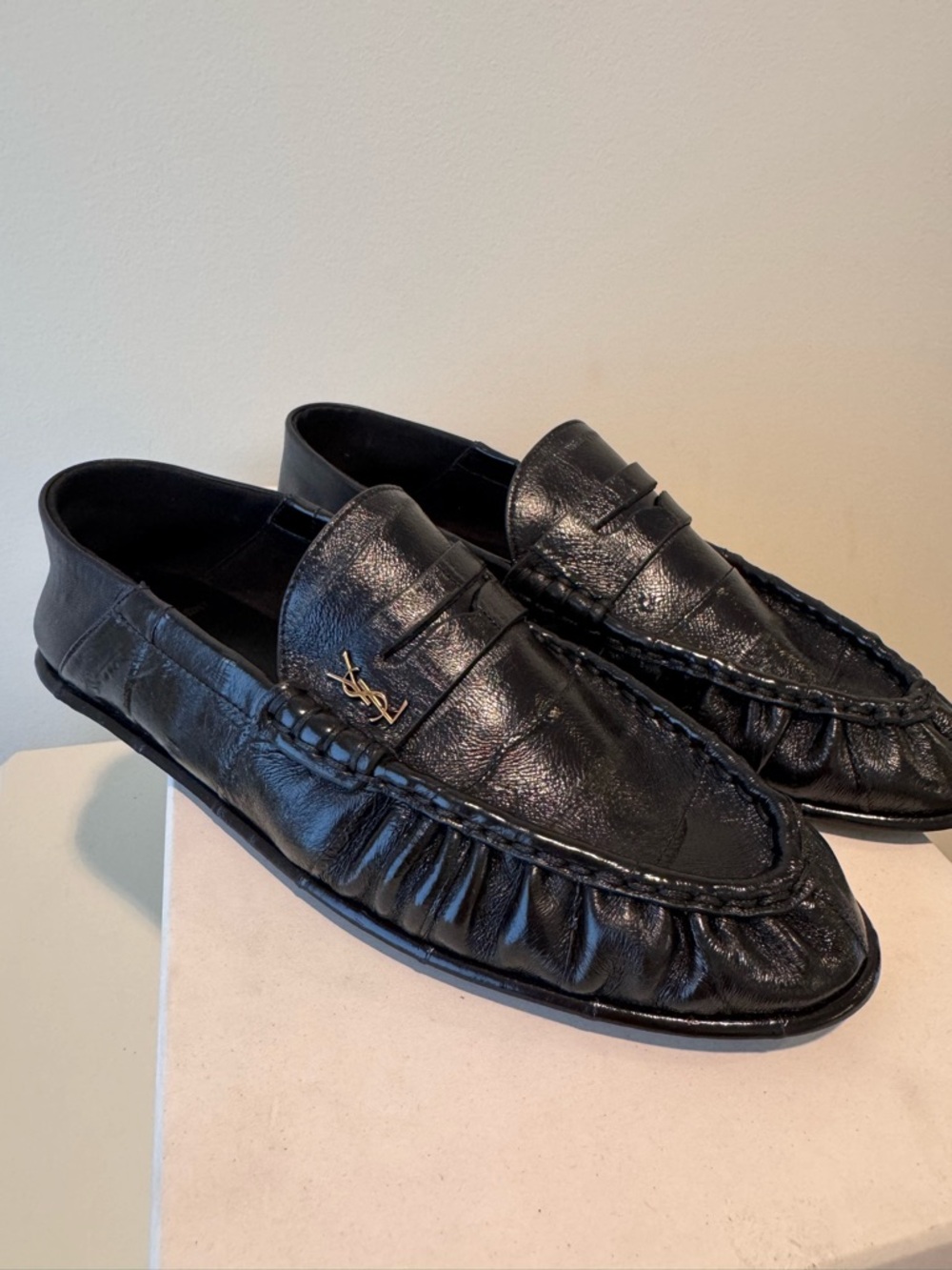 SAINT LAURENT
Le Loafer embellished collapsible-heel glossed-eel loafers